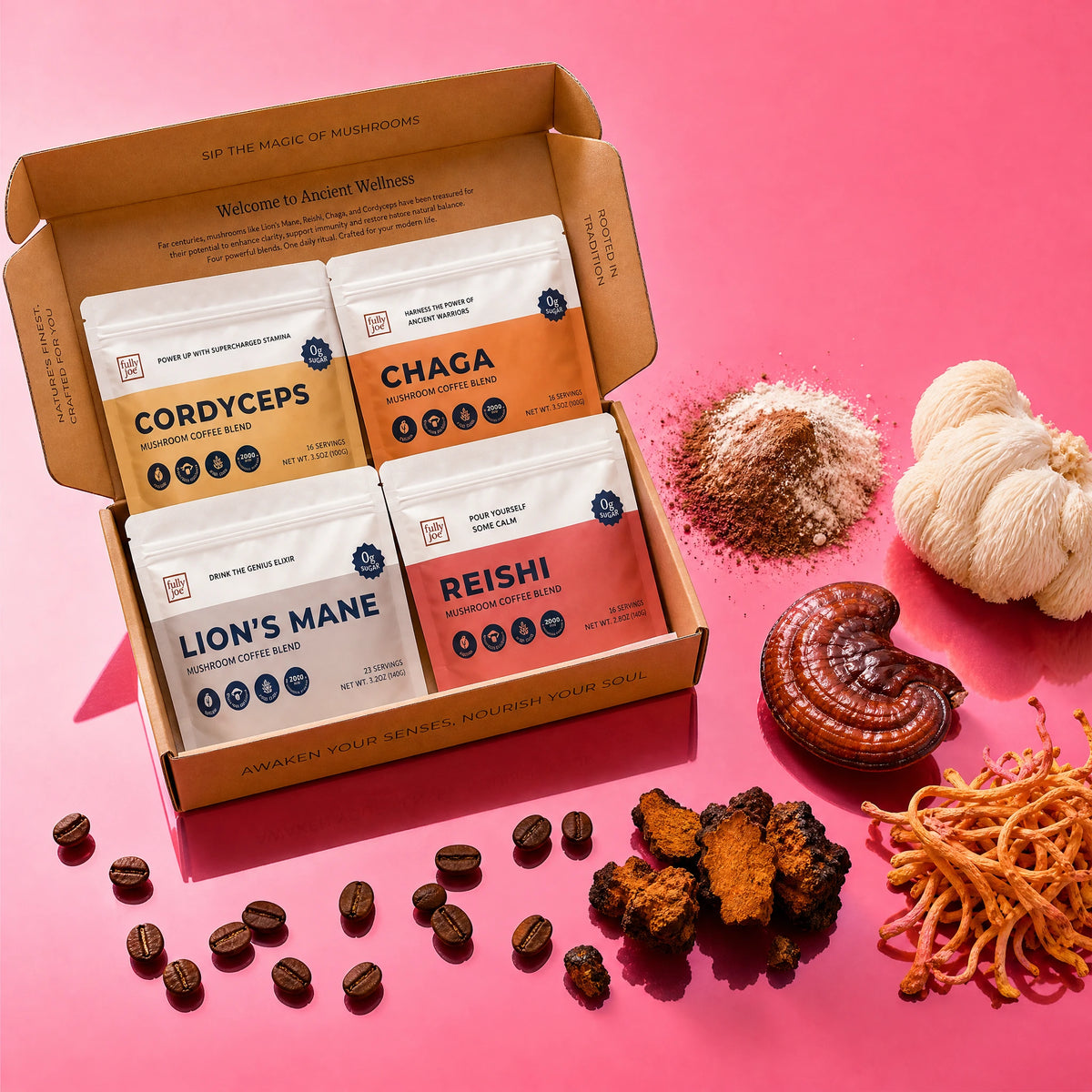 Four packs from the Fully Nutrition Mushroom Coffee Gift Set are arranged in an open box, surrounded by coffee beans, powdered blends, and whole mushrooms, all displayed on a pink background.