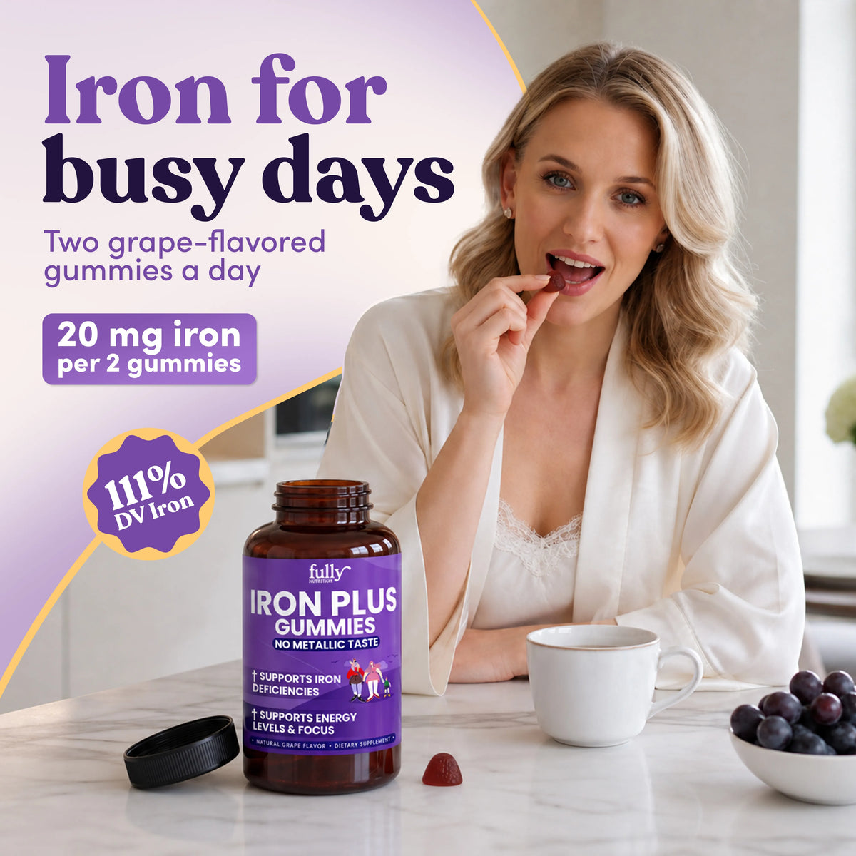 A woman sits at a table eating a grape-flavored vegan Iron Plus Gummies next to a bottle labeled to provide 111% daily value of iron per serving.