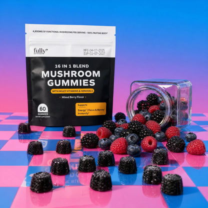 A bag labeled “Fully Nutrition 16 in 1 Mushroom Gummies” stands on a pink and blue checkered surface with assorted berries and spilled gummies from a tipped glass jar.